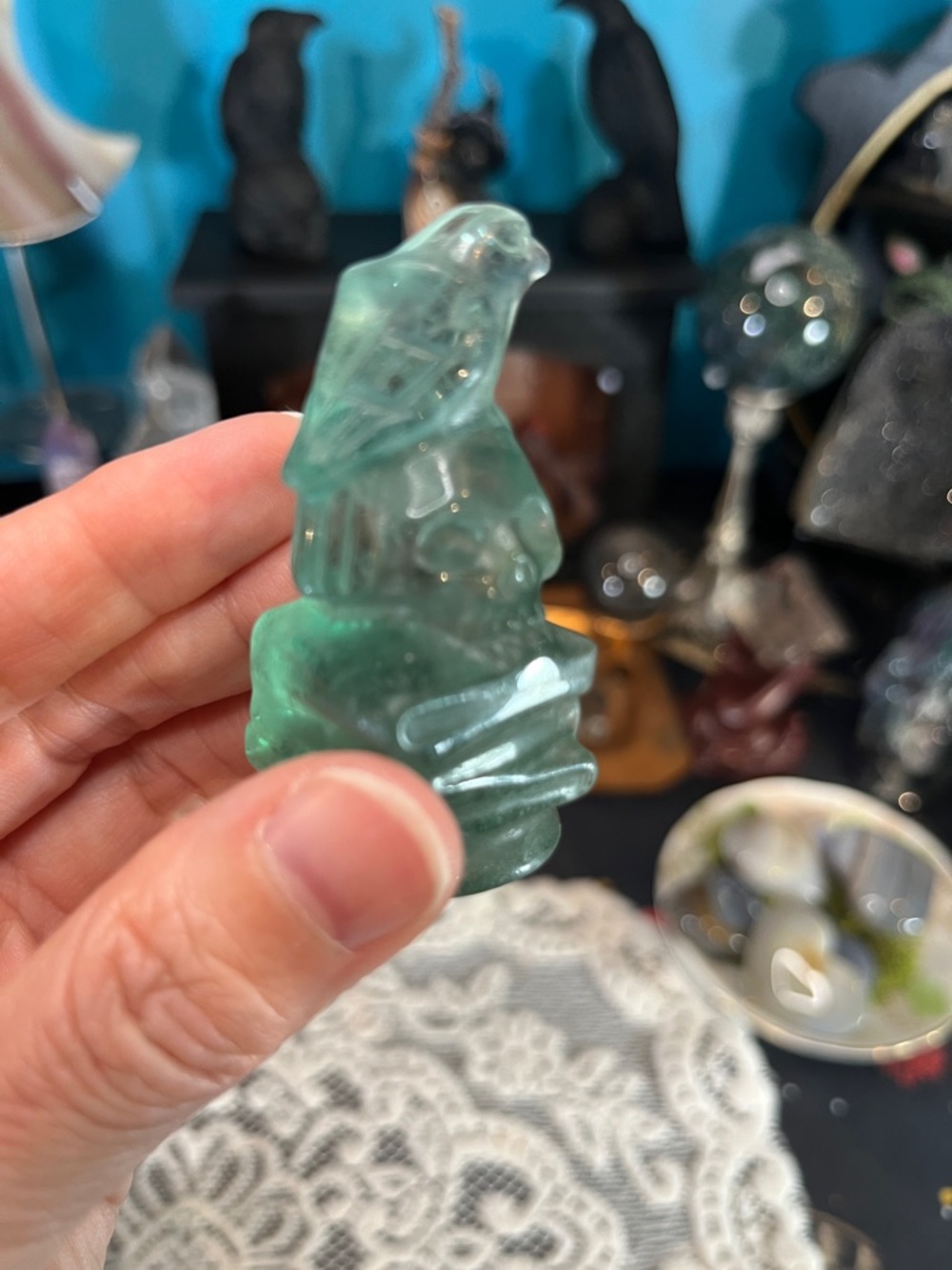 Green ( as is) flourite raven on skull and books